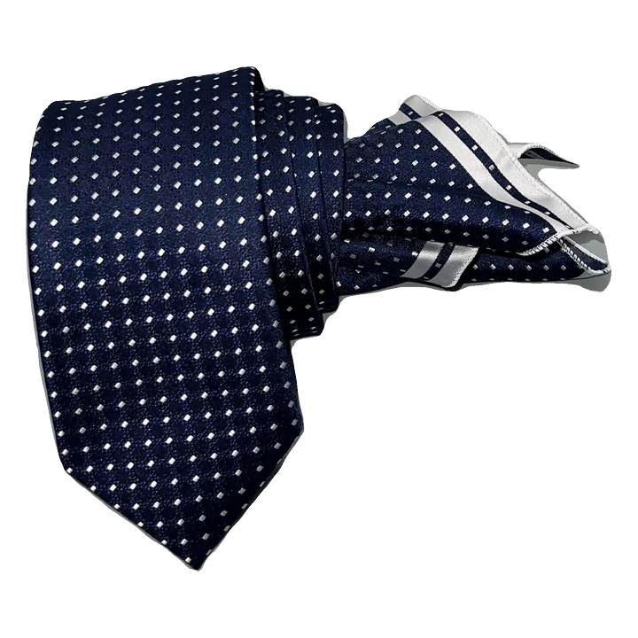 Corbata azul marino con puntos en gris perla. Pañuelo a juego con ribete gris.