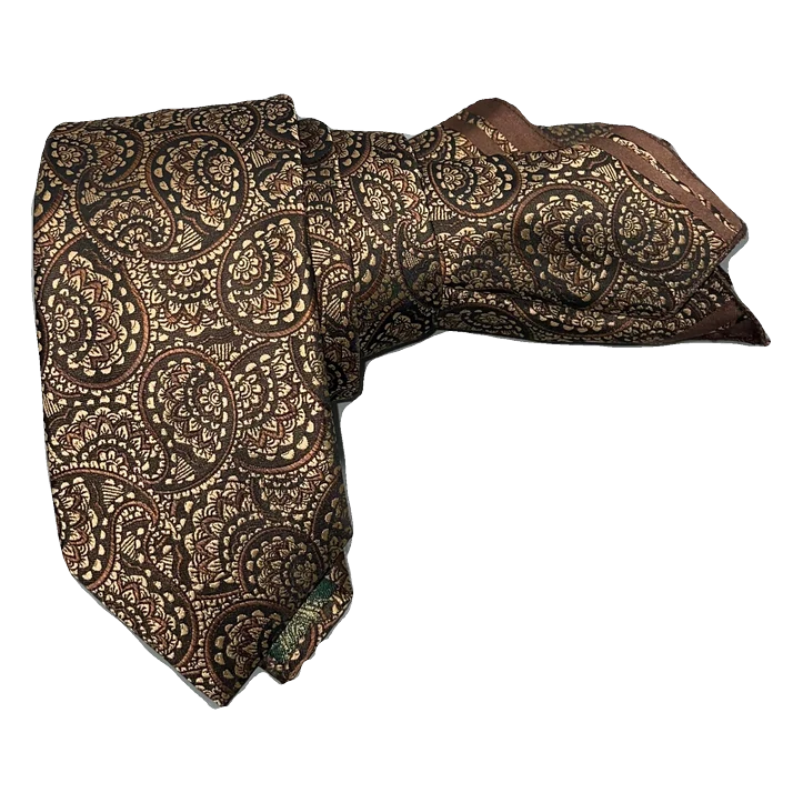 Corbata con cachemir en tonos oro y marrón efecto tornasol. Pañuelo a juego con ribete marrón.