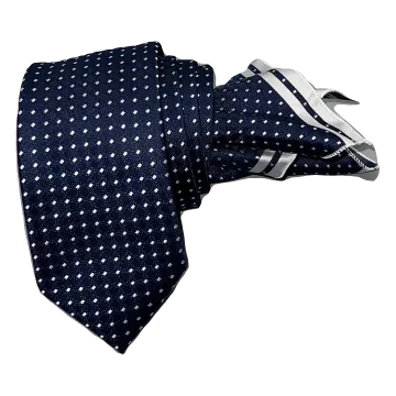 Corbata azul marino con puntos en gris perla. Pañuelo a juego con ribete gris.